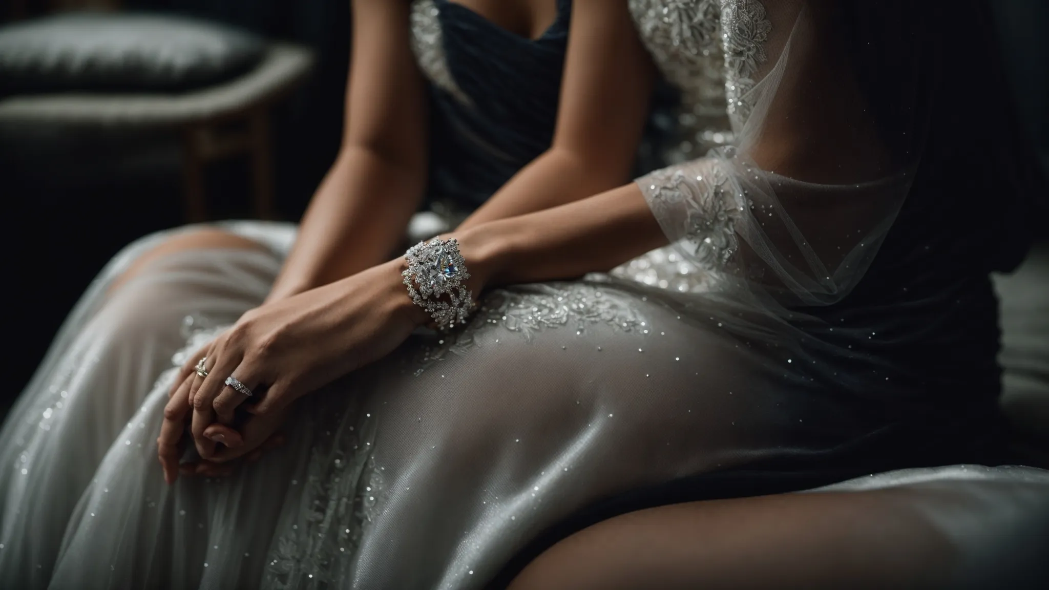 a woman wearing an elegant dress admires a shimmering diamond tennis bracelet elegantly displayed on a velvet cushion.